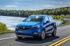Picture of a driving 2017 Buick Encore in Coastal Blue Metallic from a front left perspective