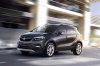 Picture of a driving 2017 Buick Encore in Graphite Gray Metallic from a front left three-quarter perspective