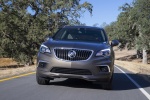 Picture of a driving 2017 Buick Envision AWD in Bronze Alloy Metallic from a frontal perspective
