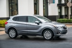Picture of a driving 2019 Buick Envision AWD in Satin Steel Metallic from a front right three-quarter perspective