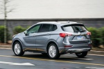 Picture of a driving 2019 Buick Envision AWD in Satin Steel Metallic from a rear left three-quarter perspective