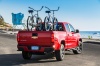 Picture of a 2015 Chevrolet Colorado Crew Cab in Red Hot from a rear right perspective