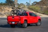Picture of a 2015 Chevrolet Colorado Crew Cab in Red Hot from a rear right three-quarter perspective