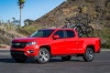 Picture of a 2015 Chevrolet Colorado Crew Cab in Red Hot from a front left three-quarter perspective