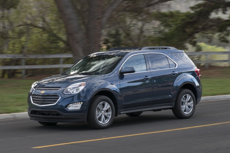 Picture of a driving 2016 Chevrolet Equinox LT in Blue Velvet Metallic from a front left three-quarter perspective