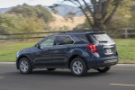 Picture of a driving 2017 Chevrolet Equinox LT in Blue Velvet Metallic from a rear left three-quarter perspective