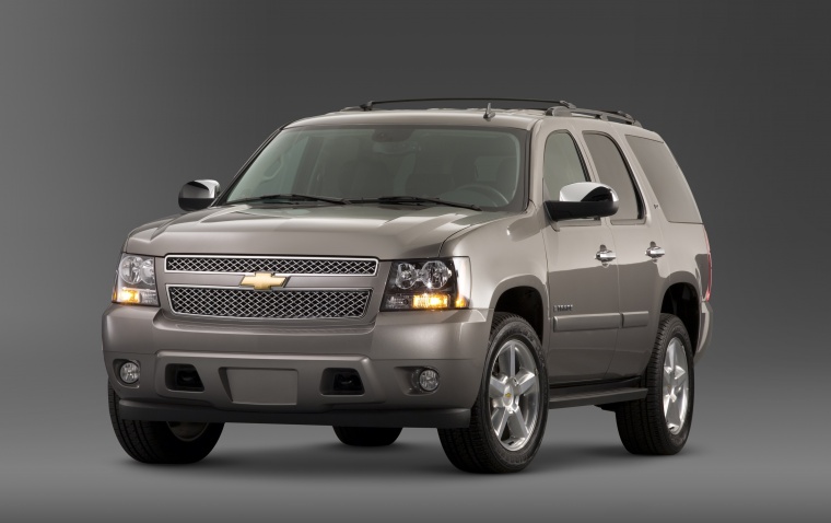 Picture of a 2014 Chevrolet Tahoe LTZ in Champagne Silver Metallic from a front left perspective