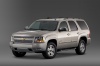 Picture of a 2014 Chevrolet Tahoe LTZ in Champagne Silver Metallic from a front left three-quarter perspective