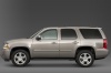 Picture of a 2014 Chevrolet Tahoe LTZ in Champagne Silver Metallic from a left side perspective