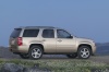 Picture of a 2014 Chevrolet Tahoe LTZ in Champagne Silver Metallic from a right side perspective