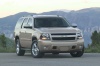 Picture of a 2014 Chevrolet Tahoe LTZ in Champagne Silver Metallic from a front right perspective