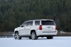 Picture of a 2015 Chevrolet Tahoe in Summit White from a rear left three-quarter perspective