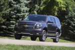 Picture of a driving 2015 Chevrolet Tahoe LT 4WD Z71 in Sable Metallic from a front left three-quarter perspective