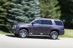 Picture of a driving 2015 Chevrolet Tahoe LT 4WD Z71 in Sable Metallic from a side perspective