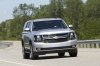 Picture of a driving 2016 Chevrolet Tahoe in Silver Ice Metallic from a front right perspective