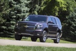 Picture of a driving 2016 Chevrolet Tahoe LT 4WD Z71 in Sable Metallic from a front left three-quarter perspective