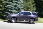 Picture of a driving 2016 Chevrolet Tahoe LT 4WD Z71 in Sable Metallic from a side perspective