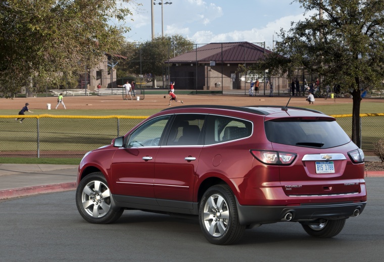 Picture of a 2014 Chevrolet Traverse LTZ AWD in Crystal Red Tintcoat from a rear left three-quarter perspective