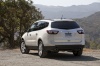 Picture of a 2014 Chevrolet Traverse LTZ in White from a rear left perspective