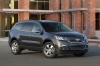 Picture of a 2015 Chevrolet Traverse LTZ AWD in Black Granite Metallic from a front right three-quarter perspective