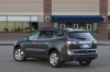 Picture of a 2016 Chevrolet Traverse LTZ AWD in Mosaic Black Metallic from a rear left three-quarter perspective