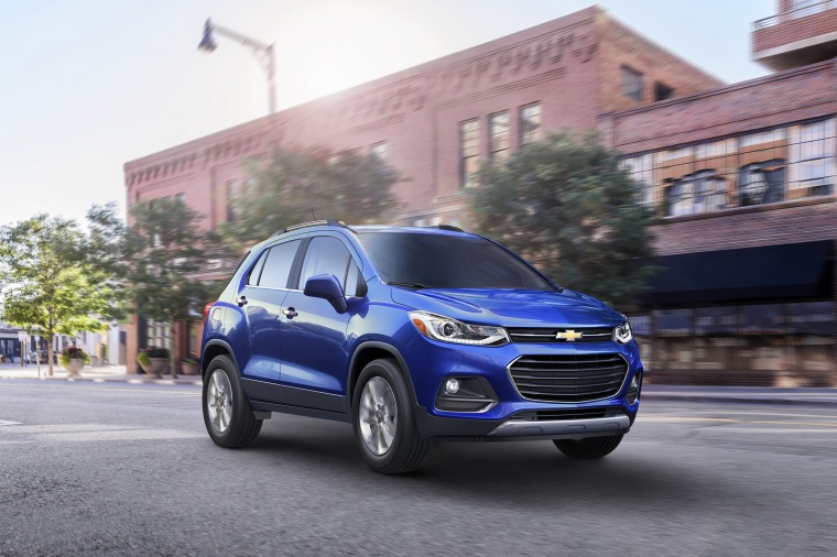 Picture of a driving 2018 Chevrolet Trax Premier in Blue from a front right three-quarter perspective