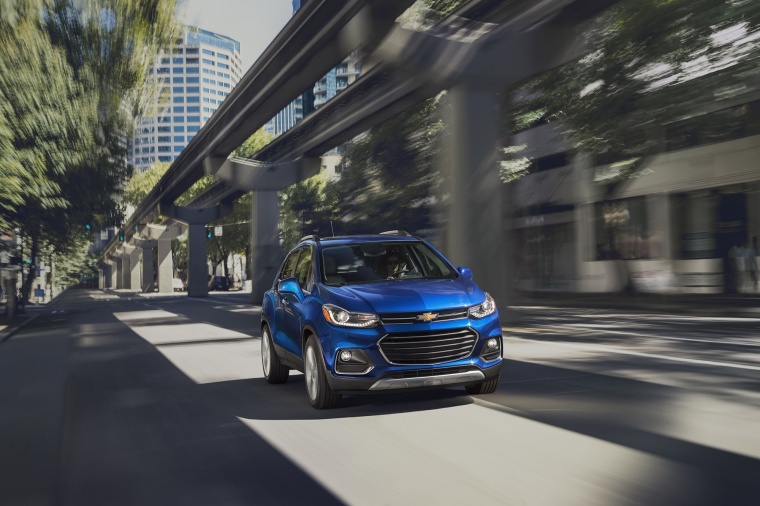 Picture of a driving 2018 Chevrolet Trax Premier in Blue from a front right perspective