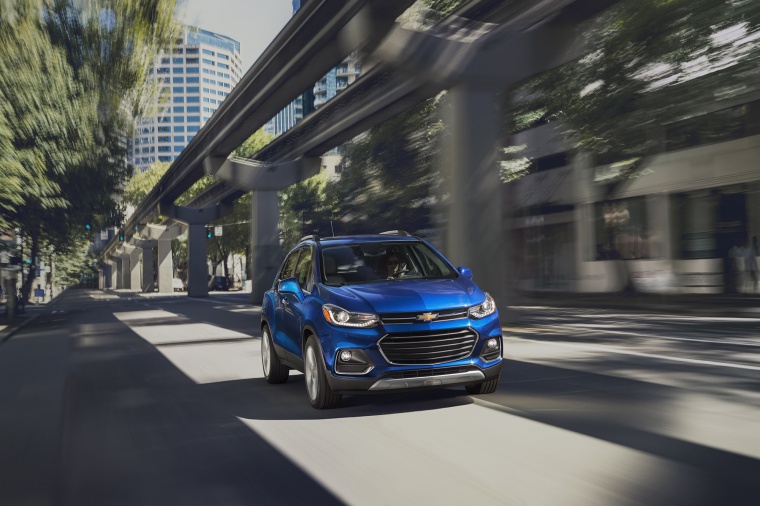 Picture of a driving 2019 Chevrolet Trax Premier in Blue from a front right perspective