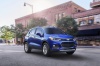 Picture of a driving 2020 Chevrolet Trax Premier in Blue from a front right three-quarter perspective