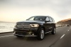 Picture of a driving 2016 Dodge Durango Citadel in Brilliant Black Crystal Pearlcoat from a front left perspective