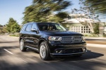 Picture of a driving 2016 Dodge Durango Citadel in Brilliant Black Crystal Pearlcoat from a front right three-quarter perspective