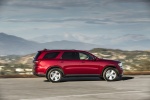 Picture of a driving 2016 Dodge Durango Limited AWD in Deep Cherry Red Crystal Pearlcoat from a right side perspective