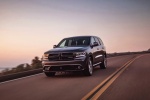 Picture of a driving 2016 Dodge Durango R/T in Maximum Steel Metallic Clearcoat from a front left perspective