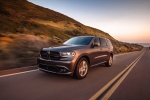 Picture of a driving 2016 Dodge Durango R/T in Maximum Steel Metallic Clearcoat from a front left three-quarter perspective