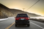 Picture of a driving 2017 Dodge Durango Citadel in Brilliant Black Crystal Pearlcoat from a rear perspective