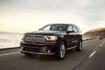 Picture of a driving 2017 Dodge Durango Citadel in Brilliant Black Crystal Pearlcoat from a front left perspective