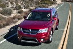 Picture of a driving 2018 Dodge Journey in Redline 2 Coat Pearl from a front left perspective