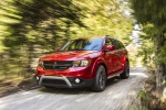 Picture of a driving 2018 Dodge Journey Crossroad AWD in Redline 2 Coat Pearl from a front left three-quarter perspective