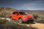 Picture of a driving 2016 Fiat 500X in Arancio from a front right three-quarter perspective