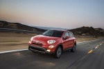 Picture of a driving 2016 Fiat 500X in Arancio from a front left perspective