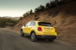 Picture of a driving 2016 Fiat 500X in Giallo Tristrato from a rear left perspective