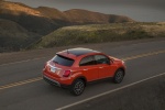 Picture of a driving 2016 Fiat 500X AWD in Arancio from a rear right three-quarter perspective