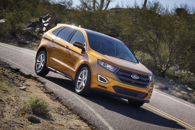 Picture of a driving 2017 Ford Edge Sport from a front right perspective