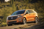 Picture of a driving 2017 Ford Edge Sport from a front left three-quarter perspective