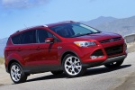 Picture of a 2014 Ford Escape Titanium 4WD in Ruby Red Tinted Clearcoat from a front right three-quarter perspective