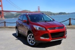 Picture of a 2014 Ford Escape Titanium 4WD in Ruby Red Tinted Clearcoat from a front right perspective