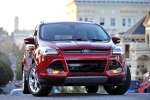 Picture of a 2014 Ford Escape Titanium 4WD in Ruby Red Tinted Clearcoat from a frontal perspective