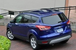 Picture of a 2014 Ford Escape SE in Deep Impact Blue from a rear left three-quarter perspective