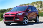 Picture of a 2014 Ford Escape Titanium 4WD in Ruby Red Tinted Clearcoat from a front left three-quarter perspective