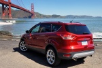 Picture of a 2014 Ford Escape Titanium 4WD in Ruby Red Tinted Clearcoat from a rear left three-quarter perspective